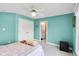 Bedroom features a ceiling fan, large window, and a closet, providing a cozy retreat at 10390 Tremont Dr, Fishers, IN 46037