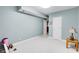 Carpeted bedroom boasts fresh light blue walls and bright natural light from the window at 10390 Tremont Dr, Fishers, IN 46037