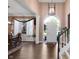 Elegant dining room featuring hardwood floors and a large arched window for natural light at 10390 Tremont Dr, Fishers, IN 46037