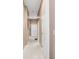 Hallway featuring white walls, tile floors, and white doors at 10390 Tremont Dr, Fishers, IN 46037