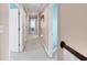 Upstairs hallway with neutral carpet, trim, and doors leading to rooms throughout the home at 10390 Tremont Dr, Fishers, IN 46037