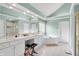 Bright main bathroom featuring double vanity, soaking tub, and plenty of counter space at 10390 Tremont Dr, Fishers, IN 46037