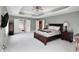Airy main bedroom with neutral decor, trey ceiling, and attached ensuite bathroom at 10390 Tremont Dr, Fishers, IN 46037
