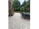 View of the patio with outdoor furniture and lush, mature landscaping at 10390 Tremont Dr, Fishers, IN 46037