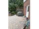 Outdoor stone patio features brick accents, grill and access to the home's door at 10390 Tremont Dr, Fishers, IN 46037