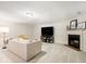 Basement living area featuring a fireplace, television, and comfortable seating, perfect for entertaining at 1045 Millwood Ct, Indianapolis, IN 46260
