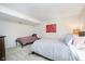 Carpeted bedroom with a double bed, day bed, and modern decor at 1045 Millwood Ct, Indianapolis, IN 46260