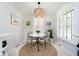 Cozy breakfast nook featuring a round table, pendant lighting, and shuttered windows for bright, natural light at 1045 Millwood Ct, Indianapolis, IN 46260