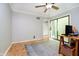 Office space with a ceiling fan, desk and a view of the outdoors from the sliding door at 1045 Millwood Ct, Indianapolis, IN 46260