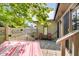 Private patio with hammock, paver flooring, privacy fence, and mature trees at 1045 Millwood Ct, Indianapolis, IN 46260
