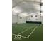 Spacious indoor tennis court with high ceilings and ample lighting for year-round play at 1045 Millwood Ct, Indianapolis, IN 46260