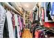Spacious walk-in closet with shelving and ample hanging storage for organized clothing and accessories at 1045 Millwood Ct, Indianapolis, IN 46260