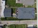 Aerial view showcasing the house with a spacious backyard, deck, and the surrounding neighborhood at 1048 St Peter St, Indianapolis, IN 46203