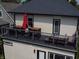 Upper level balcony with outdoor seating offering an amazing space to relax and enjoy the view at 1048 St Peter St, Indianapolis, IN 46203