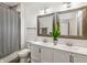 Well-lit bathroom featuring double sinks, modern fixtures, and a shower-tub combination for relaxation at 1048 St Peter St, Indianapolis, IN 46203