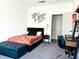 Modern bedroom with comfortable bed, stylish decor, and a dedicated workspace area at 1048 St Peter St, Indianapolis, IN 46203