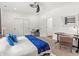 Comfortable bedroom with plush carpet, ample closet space, and a desk area perfect for work or study at 1048 St Peter St, Indianapolis, IN 46203