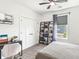 Bright bedroom featuring carpet floors, a modern desk, and a closet perfect for a comfortable living space at 1048 St Peter St, Indianapolis, IN 46203
