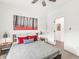 Stylish bedroom with modern decor, comfortable bed, and a vibrant art piece adding a touch of flair at 1048 St Peter St, Indianapolis, IN 46203