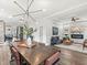 Open-concept dining area featuring a stylish table, modern lighting, and seamless flow to the living room at 1048 St Peter St, Indianapolis, IN 46203