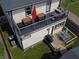 A multi-level deck outside featuring a grill, dining area, and comfortable seating for outdoor enjoyment at 1048 St Peter St, Indianapolis, IN 46203
