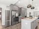 Gray kitchen with stainless steel appliances and large center island at 1048 St Peter St, Indianapolis, IN 46203