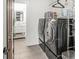 Convenient laundry room featuring modern washer and dryer with a stylish bathroom nearby at 1048 St Peter St, Indianapolis, IN 46203