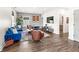 Spacious living room featuring hardwood floors, modern decor, and ample natural light from large windows at 1048 St Peter St, Indianapolis, IN 46203