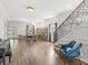 Bright and airy living room with hardwood floors and modern staircase at 1048 St Peter St, Indianapolis, IN 46203