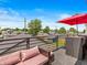 Relaxing patio featuring comfortable seating, an umbrella for shade, and a great view at 1048 St Peter St, Indianapolis, IN 46203