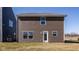 Spacious backyard featuring brown siding, a door entrance, and plenty of room for outdoor activities at 1105 Lona Dr, Martinsville, IN 46151
