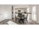 Bright kitchen with white cabinets, stainless steel appliances, and a dining area perfect for Gathering meals at 1105 Lona Dr, Martinsville, IN 46151