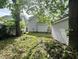 A leafy backyard, ready for landscaping and gardening; includes a detached garage at 1153 Dawson St, Indianapolis, IN 46203