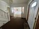Foyer with original staircase and transom window over the front door; ready for restoration at 1153 Dawson St, Indianapolis, IN 46203