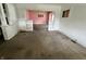 Open-concept living room with decorative columns, ready for renovation and your personal touches at 1153 Dawson St, Indianapolis, IN 46203