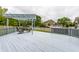 Spacious back deck with a pergola, outdoor dining set, and a serene view of the backyard at 11674 Timken Ct, Fishers, IN 46037