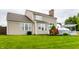 Backyard view with well-kept lawn and attractive landscaping and rear home exterior at 11674 Timken Ct, Fishers, IN 46037