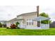 Backyard of home with a deck, tidy lawn, and exterior elevation of the house at 11674 Timken Ct, Fishers, IN 46037