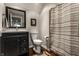 Traditional bathroom with vanity, mirror, and patterned shower curtain at 11674 Timken Ct, Fishers, IN 46037