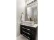 Modern powder room featuring vessel sink, vanity, and decorative stone accent wall at 11674 Timken Ct, Fishers, IN 46037
