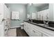 Bathroom with a granite countertop vanity with dual sinks and a shower with floral accents at 11674 Timken Ct, Fishers, IN 46037
