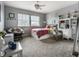 Inviting bedroom with a ceiling fan, large window, comfy chair, and stylish decor at 11674 Timken Ct, Fishers, IN 46037
