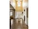 Grand foyer with soaring ceilings, hardwood floors, white trim, and a stylish chandelier at 11674 Timken Ct, Fishers, IN 46037