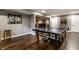 Spacious game room with ping pong table and hardwood floors at 11674 Timken Ct, Fishers, IN 46037