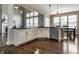 Eat-in kitchen with hardwood floors, granite counters, white cabinets and stainless steel appliances at 11674 Timken Ct, Fishers, IN 46037