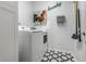Laundry room with a washing machine, dryer, striking patterned floor, and cheerful wall decor at 11674 Timken Ct, Fishers, IN 46037