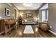 Comfortable living room featuring hardwood floors, neutral walls, and a cozy seating arrangement at 11674 Timken Ct, Fishers, IN 46037