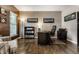 Traditional office space with wood floors, built in bookshelves, desk and neutral paint at 11674 Timken Ct, Fishers, IN 46037