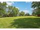 Expansive, green lawn in backyard of property at 11733 East 21St St, Indianapolis, IN 46229