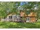 Backyard of home featuring wood deck and lush lawn at 11733 East 21St St, Indianapolis, IN 46229
